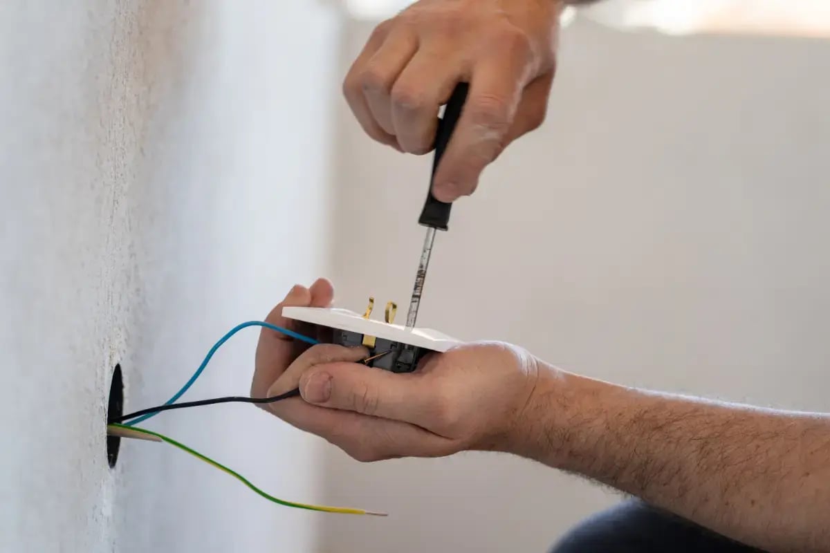 dbc-close-up-man-holding-hands-against-wall