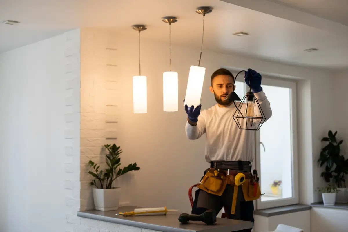 dbc-electrician-installing-led-light-bulbs-ceiling-lamp